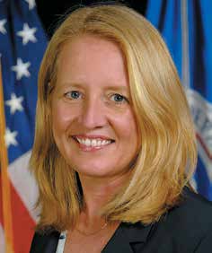 Headshot of Deanne Criswell in front of an American Flag