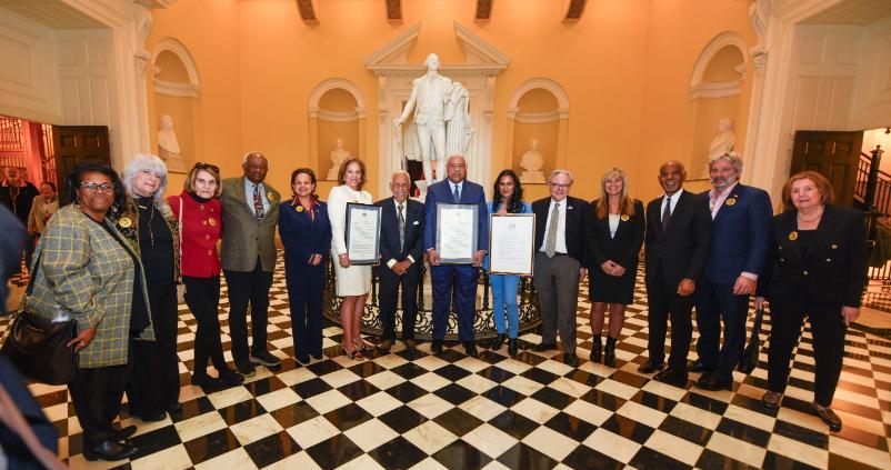 Governor Wilder is gathers with lawmakers during a center aisle ceremony in his honor.