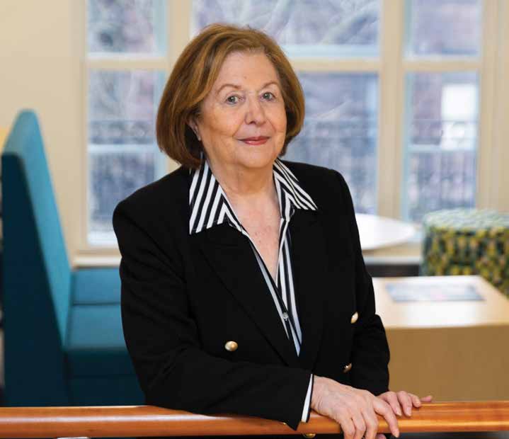 Headshot of eva teig sitting at a desk