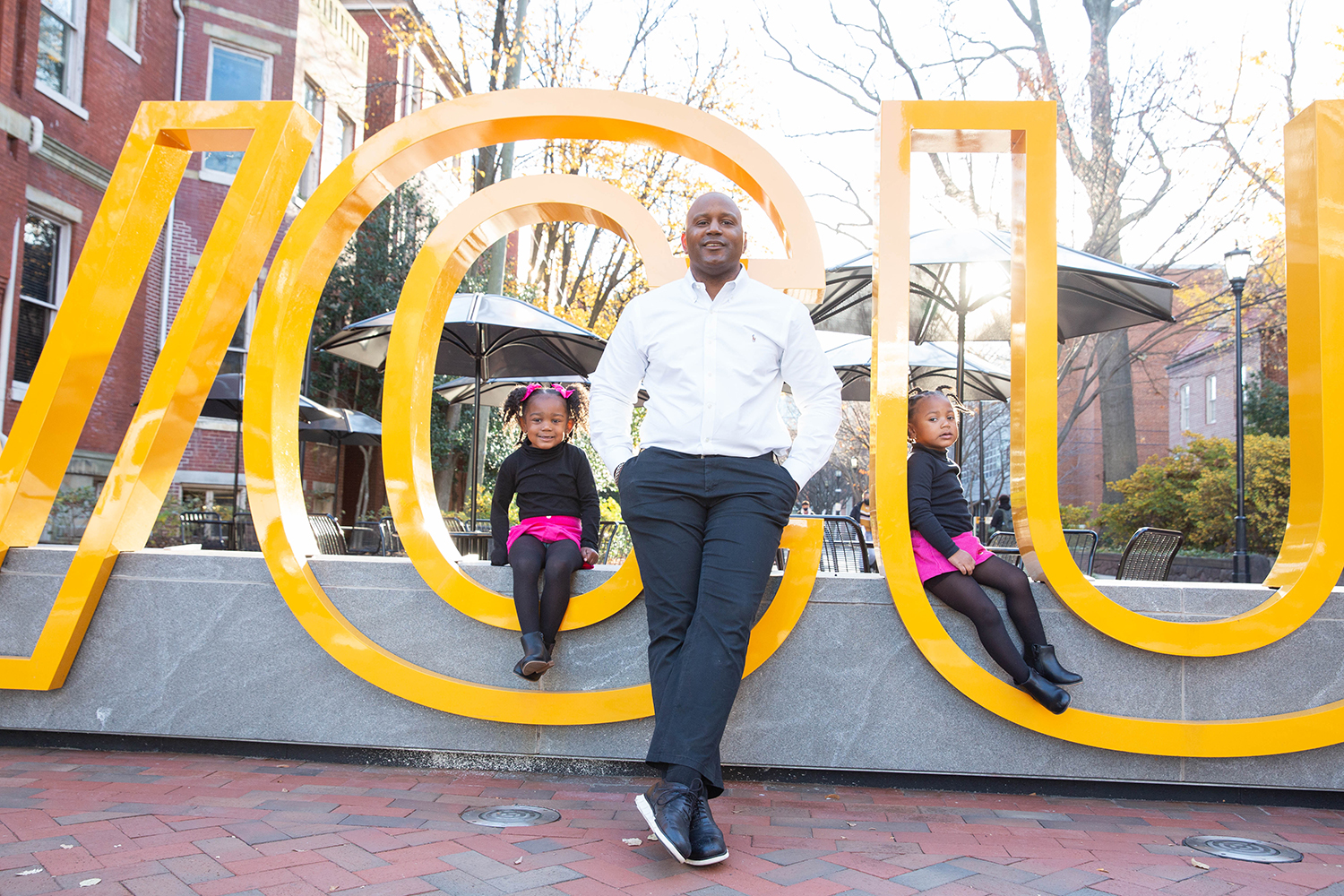 Proud of his alma mater, LeQuan Hylton shares his VCU spirit with daughters Carter (left) and Emory (right).