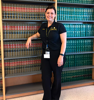 Blythe Bowman Balestrieri, Ph.D., poses in the Law Library at the Richmond City Justice Center. 