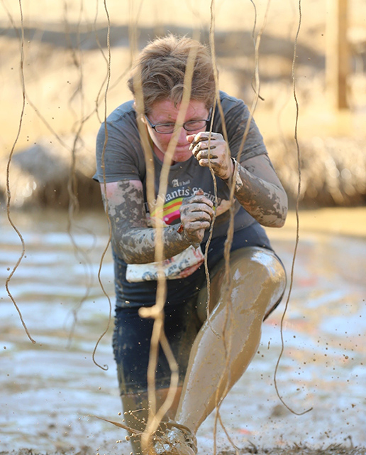 Danielle Shutt wades in a deep mud pit in her first-ever Tough Mudder obstacle course on June 11. 