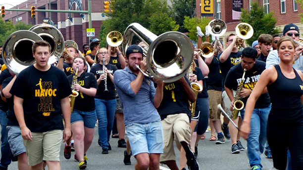 The Peppas led new students on a spirit walk down Broad Street.