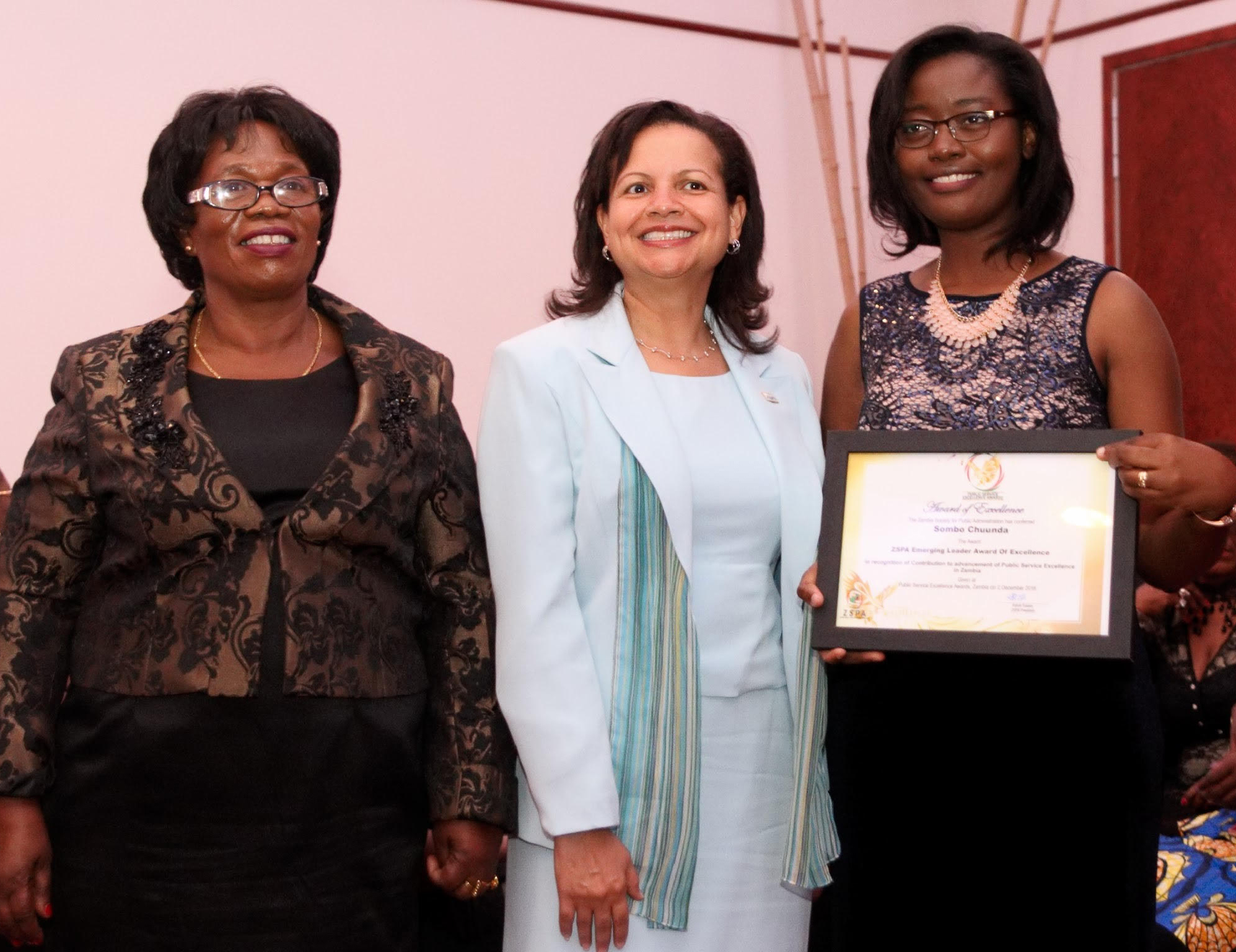 Sombo Chunda received the Young Public Service Leader Award at a dinner and awards ceremony held in Lukasa on December 5. The award was presented by Zambia’s Vice President Inonge Wina (left) and Wilder School Professor and President of the American Society of Public Administration, Susan Gooden, Ph.D.(center).