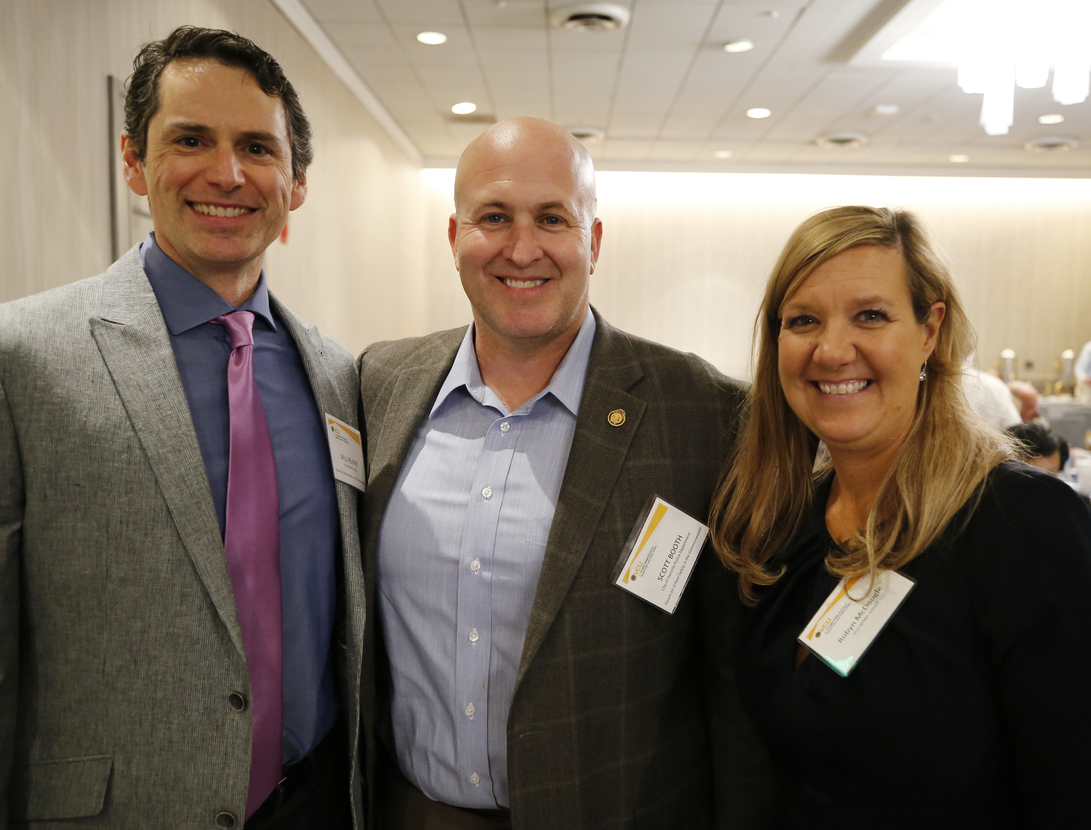 Dr. William V. Pelfrey Jr. (left), Wilder School associate professor, with Danville Police Chief and Wilder School alumnus Scott Booth, and Dr. Robyn McDougle, interim director of the Center for Public Policy, at the Forum on School Safety in the Commonwealth.