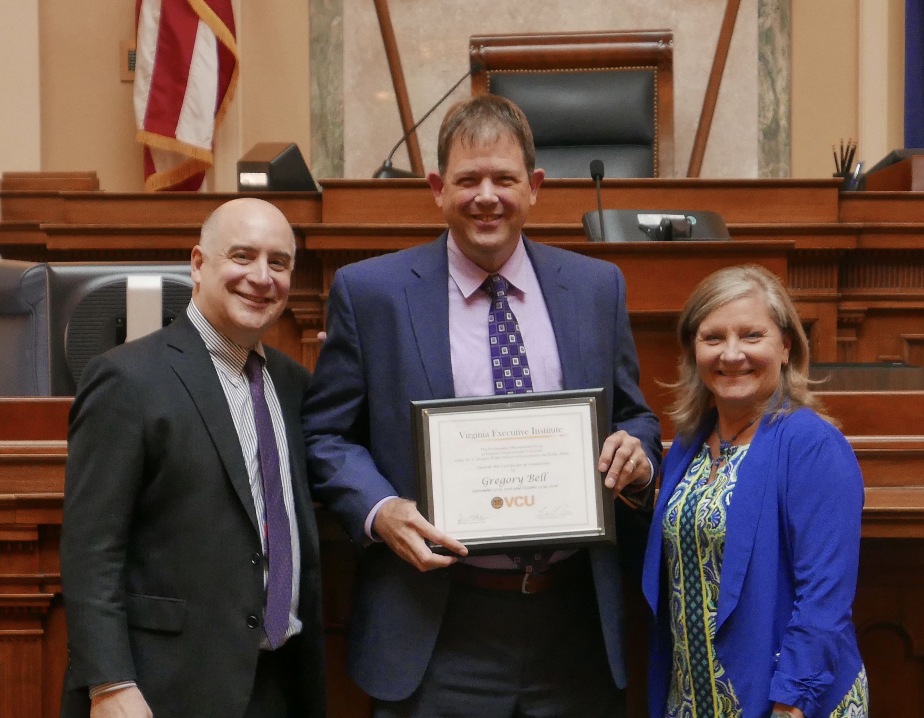 Fall 2018 VEI graduate, Greg Bell, with James Burke and Linda Pierce at graduation at the state Capitol.
