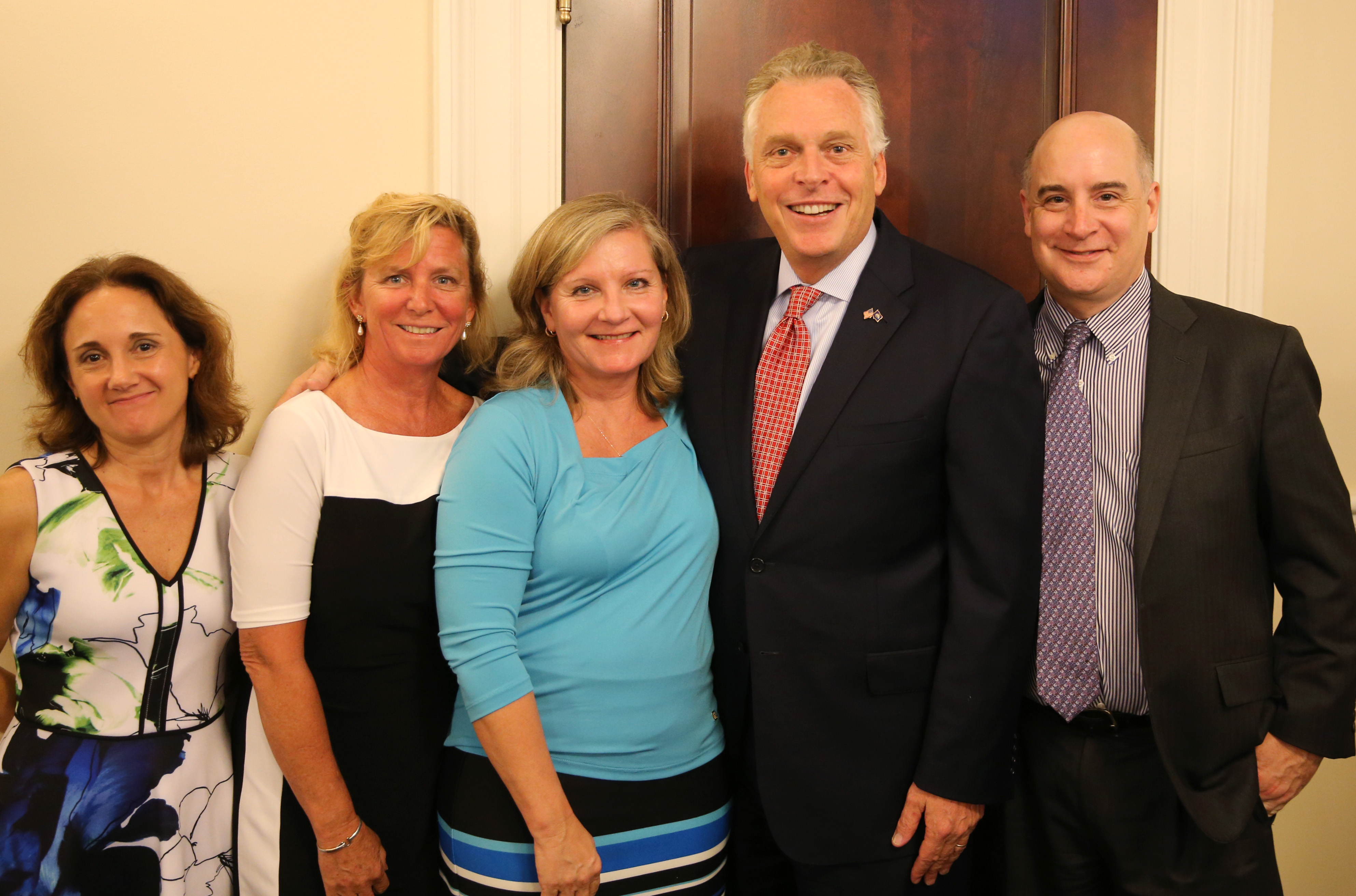 Gov. Terry McAuliffe with, from right, PMG Director James Burke, Linda Pierce, Deb Taminger and Diana Sardelis.