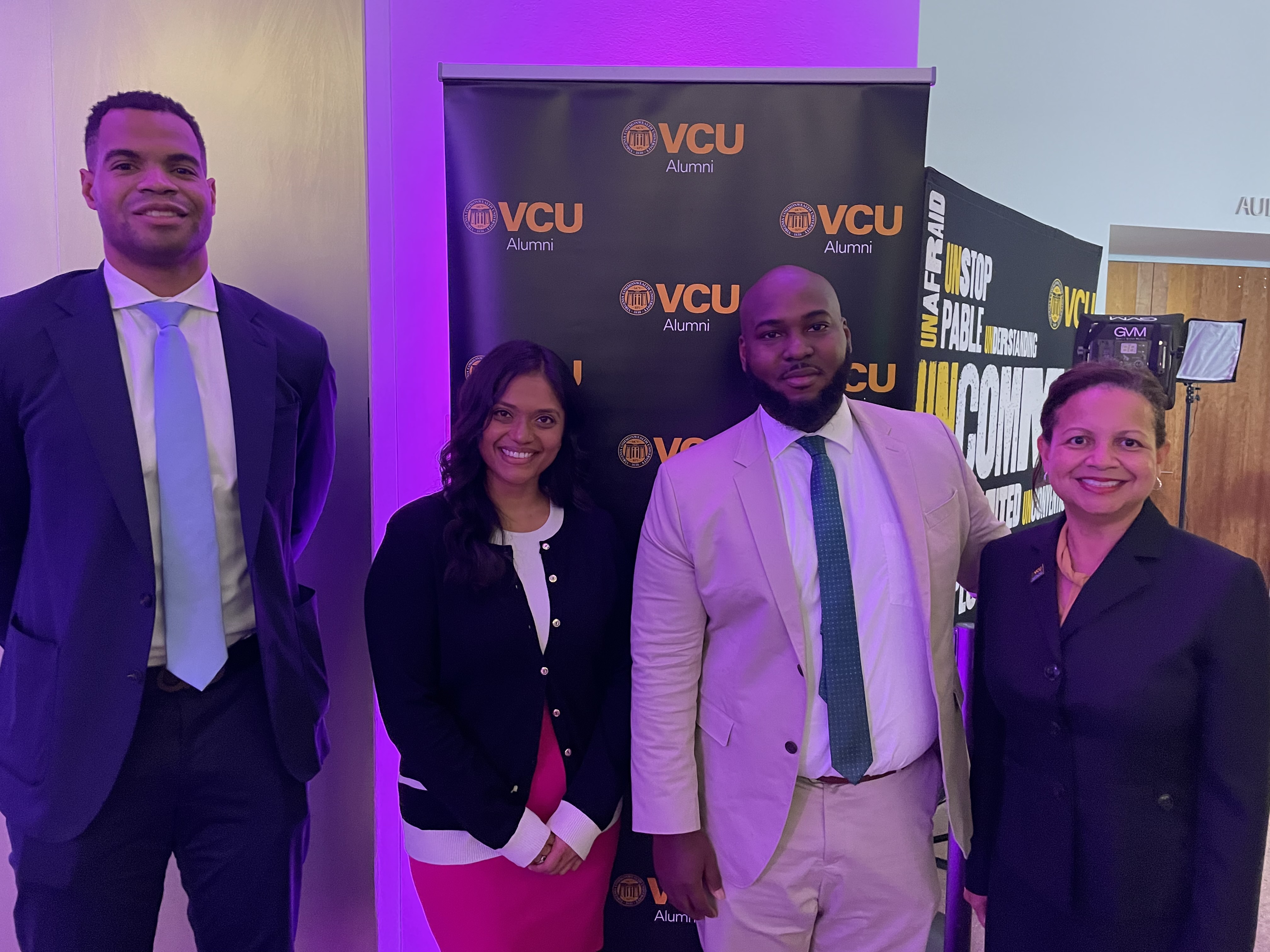 From left to right: Wilder School alumnus David Hinton Jr., a 2021 10 under 10 recipient, poses with Darrion Holloway, Dhara Minesh Amin and Susan Gooden, dean of the Wilder School.