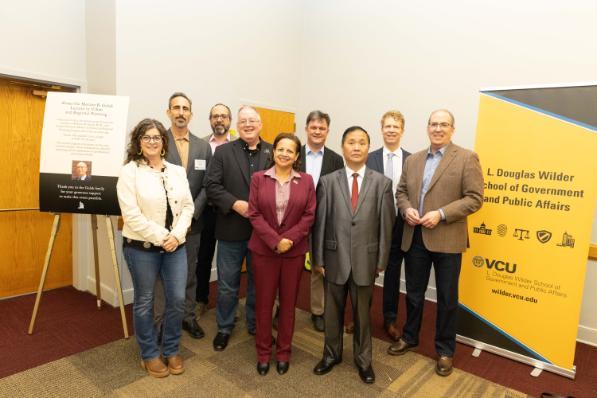 Victor Dover poses with Wilder School faculty and Gulak Lecture supporters