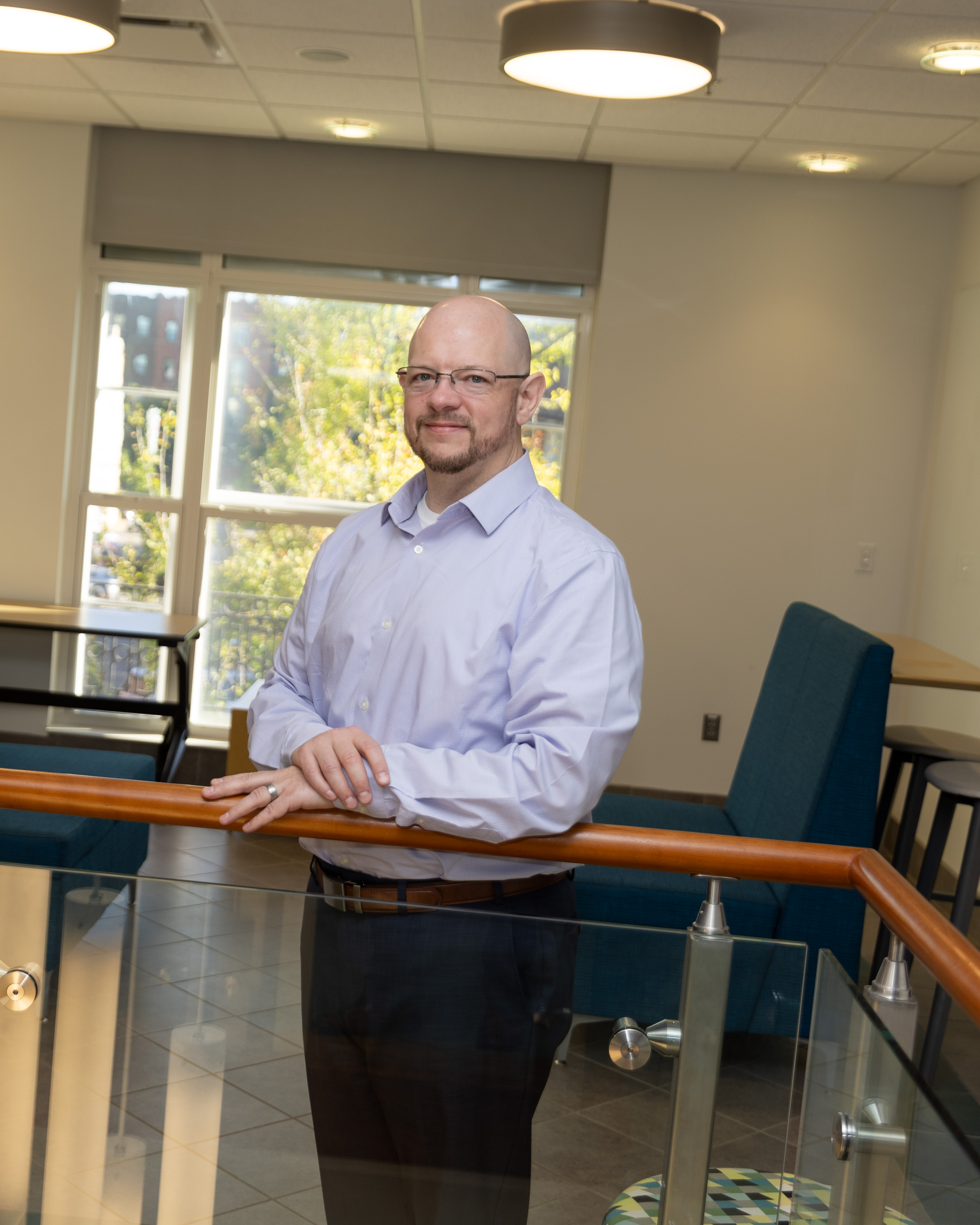 David Dearden poses on the second floor of the Raleigh Building