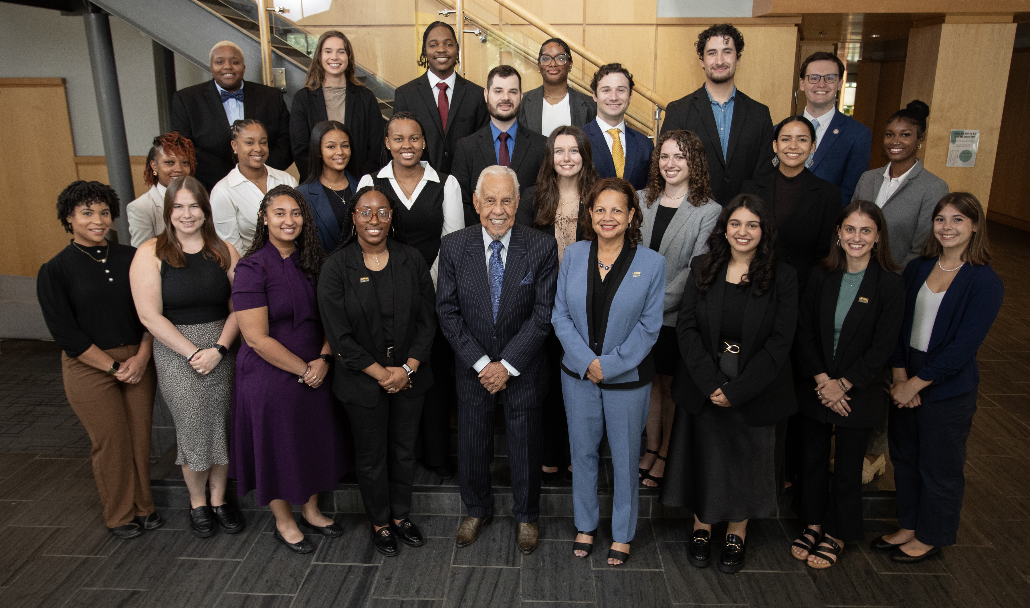 Empowering the Next Generation: The 2024 Wilder Graduate Scholars Fellows, pictured here with Governor L. Douglas Wilder and Dean Susan Gooden. These 24 ambitious students are set to make significant contributions to public policy and administration across Virginia.