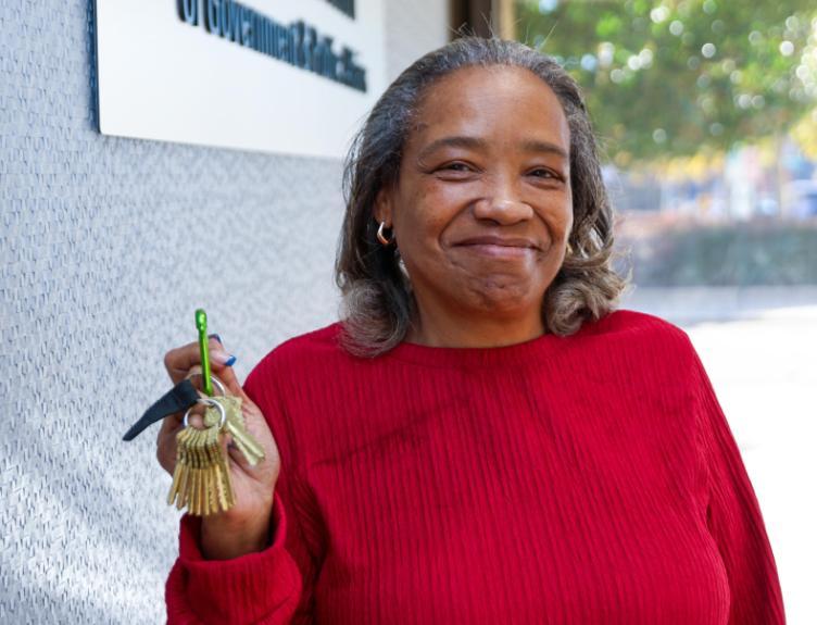 Tina Braden flashes her set of building keys with a smile.