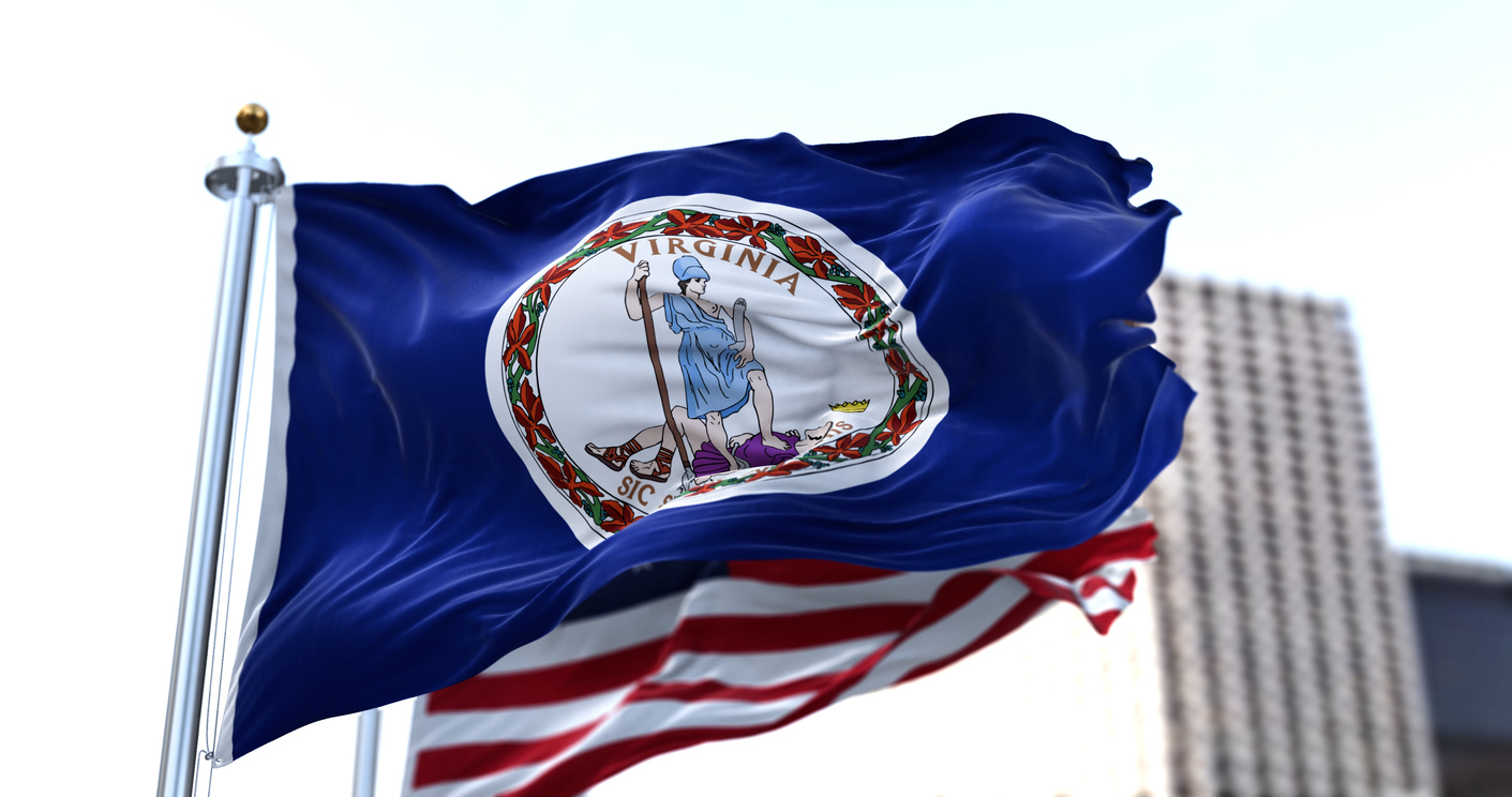 Virginia Flag waving in front of U.S. flag