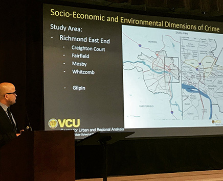 Sarin Adhikari, Ph.D., research economist at CURA, makes a presentation at the Communities and Public Safety Stakeholders’ Roundtable: An Analysis of Root Causes of Crime in the City of Richmond. 