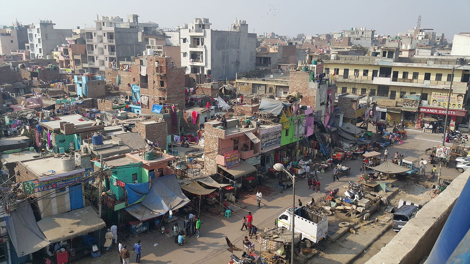 Slums, or informal settlements like these in Delhi, India, often lacking adequate access to essential services like connection lines to sewage systems. Shruti Syal